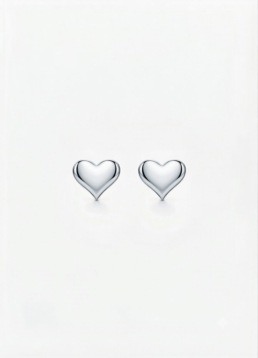 A pair of polished, high-shine silver heart-shaped stud earrings with push on butterflies.