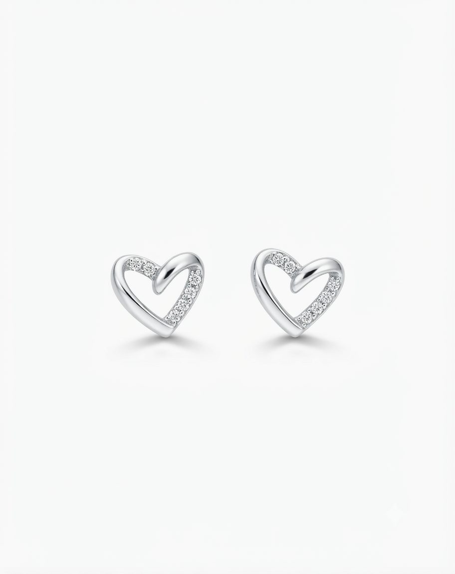 A pair of polished silver heart-shaped stud earrings featuring small cubic zirconia along one side of the heart, with push on butterflies.
