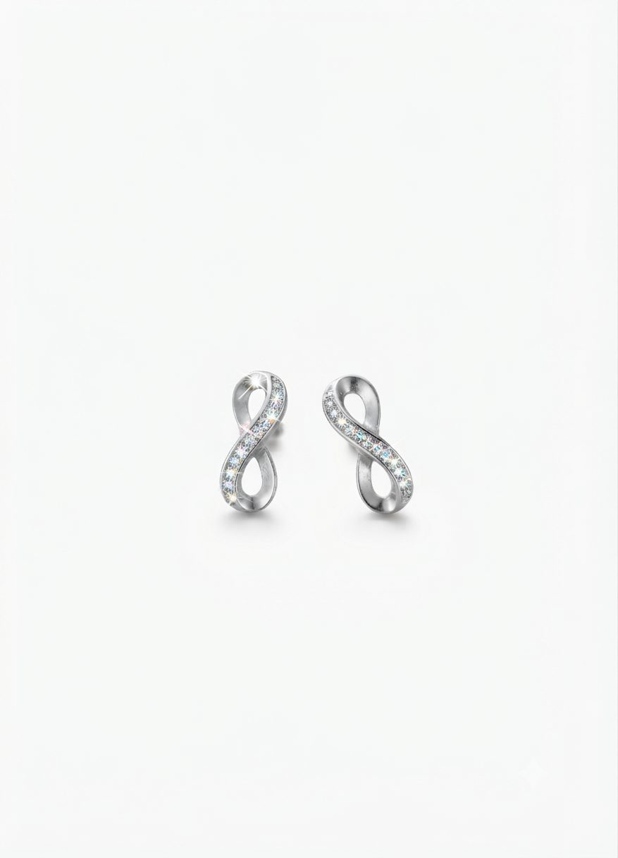 A pair of infinity-shaped earrings crafted from a polished silver-tone metal and is embellished with a delicate row of sparkling cubic zirconia, with push on butterflies.