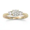 A timeless three-stone setting featuring a striking center diamond of 0.50ct. flanked by two matching side stones of 0.20ct. round brilliant cut lab grown diamonds, expertly crafted to maximize brilliance and fire.