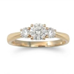 A timeless three-stone setting featuring a striking center diamond of 0.50ct. flanked by two matching side stones of 0.20ct. round brilliant cut lab grown diamonds, expertly crafted to maximize brilliance and fire.