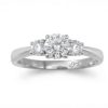 A timeless three-stone setting featuring a striking center lab grown diamond of 0.50ct flanked by two matching side lab grown diamonds of 0.20ct. set in 9ct. White Gold, size M