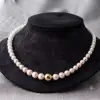 Elevate your everyday elegance with this classic high luster, bright white freshwater pearl necklace, 40cm long, with gold colour ball magnetic clasp for effortless wear.
