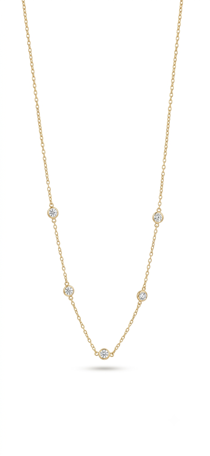 Elevate your everyday luxury with our yellow gold cubic Zirconia station necklace. Featuring sparkling Cubic Zirconia in bezel setting.