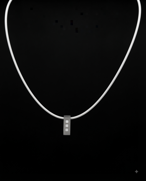 Stainless steel pendant featuring three white enamel square inlays, suspended on a smooth white rubber cord with a secure clasp. 50 cm long