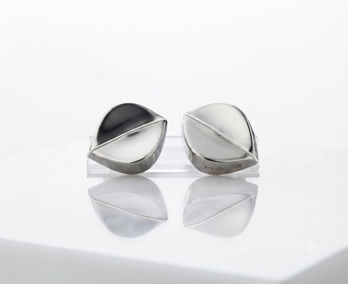 Finley1787489929784 Sterling silver leaf-shaped stud earrings with a polished finish designed for clip on earrings.