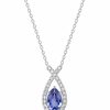 9ct white gold iolite and diamond pendant on a 9ct white gold necklace, featuring a pear-shaped blue-violet iolite surrounded by sparkling diamonds, on a 9ct white gold chain.