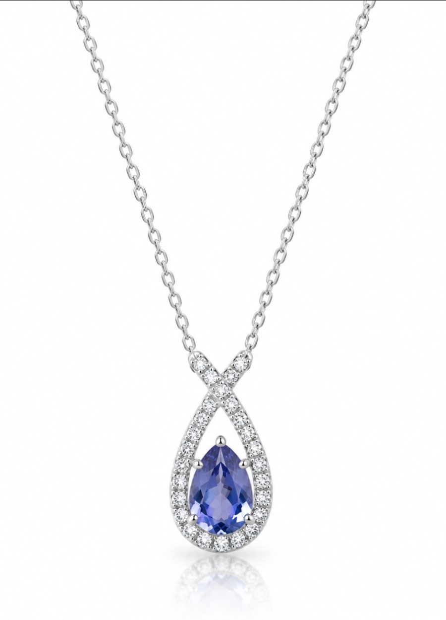 9ct white gold iolite and diamond pendant on a 9ct white gold necklace, featuring a pear-shaped blue-violet iolite surrounded by sparkling diamonds, on a 9ct white gold chain.